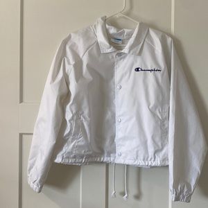 white champion wind breaker jacket with colorful wording.